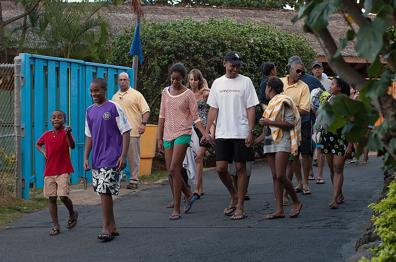President Barack Obama holds hands with daughters Malia and Sasha while they walk with friends at Sea Life Park in Honolulu on Dec. 27, 2011.Kent Nishimura/Getty Images